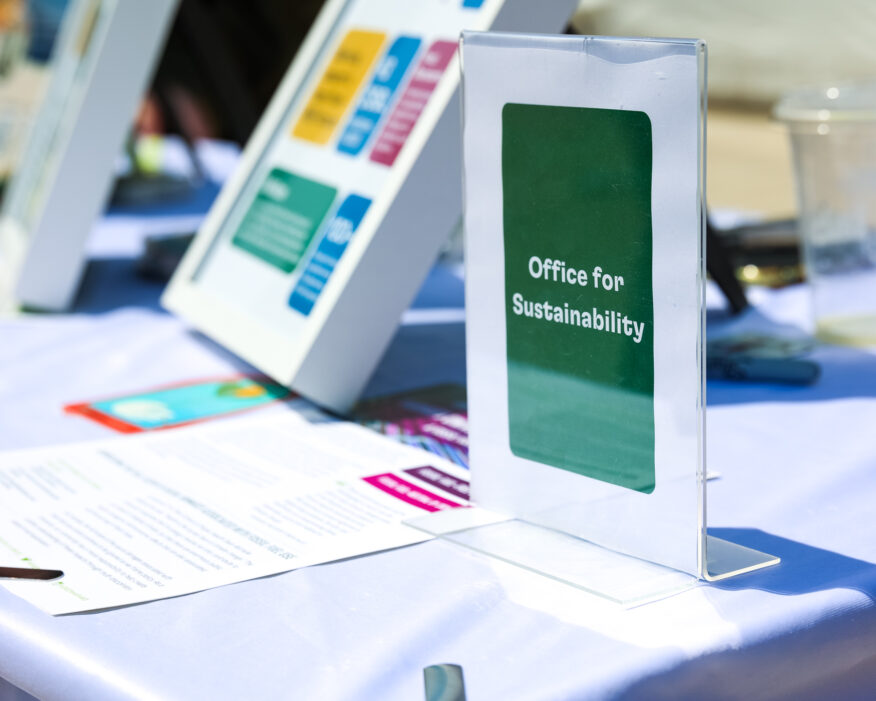 Close-up of tabling materials and signage during a Harvard Earth Day event in 2023.