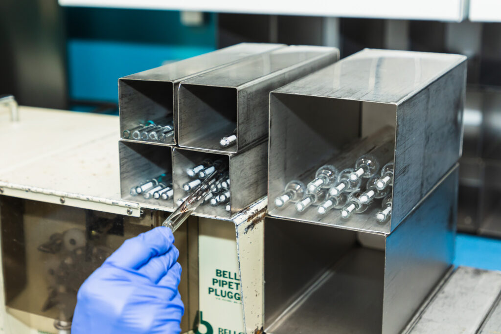 Glass pipettes are organized in a Harvard lab.
