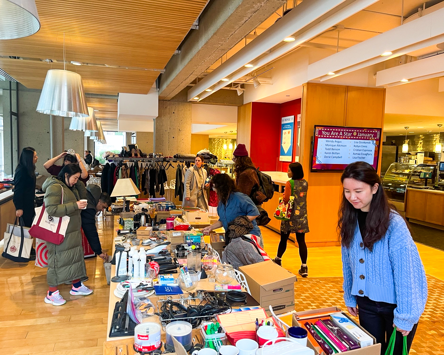 Students shop from a table of donated items at a "freecycle" event at Harvard.