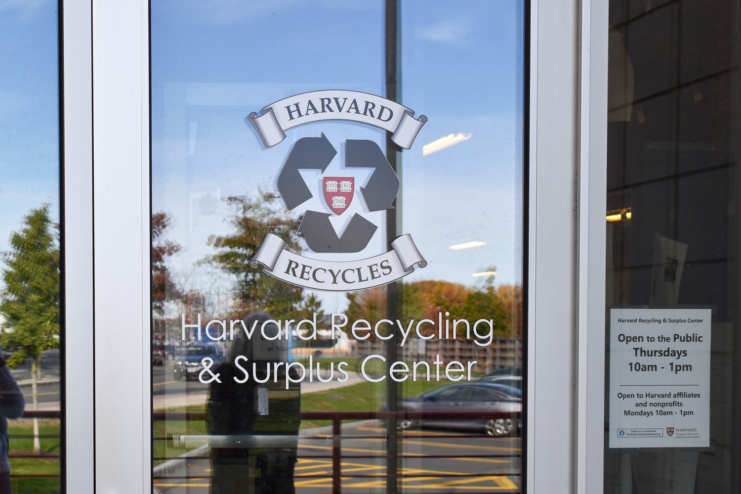 Harvard Recycling and Surplus Center Sign on a glass door.