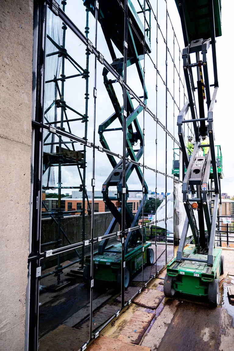 Exterior of Gund Hall during a renovation. Photos by Jon Ratner