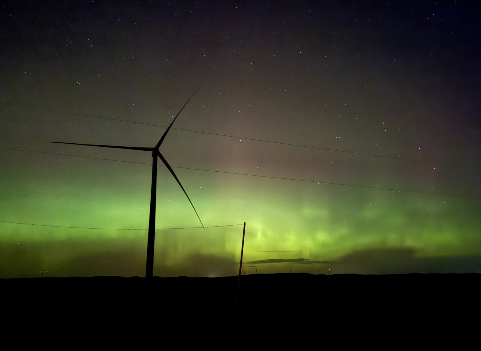 Wind turbine with the northern lights in the background at Bowman Wind.